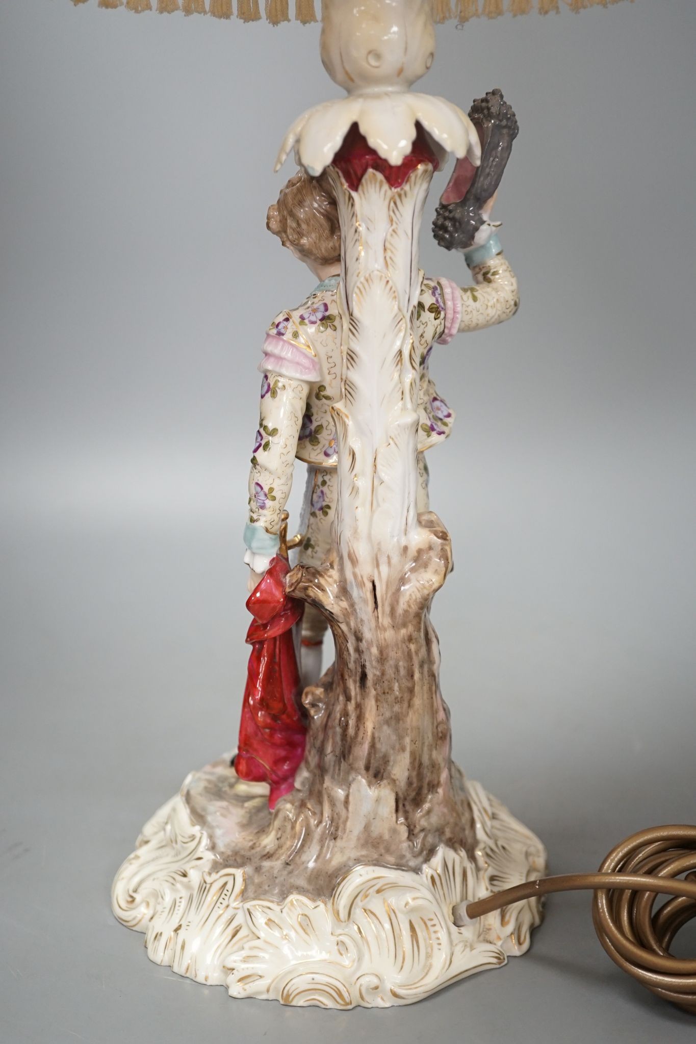 A German porcelain 'matador' lamp and shade 57cm total